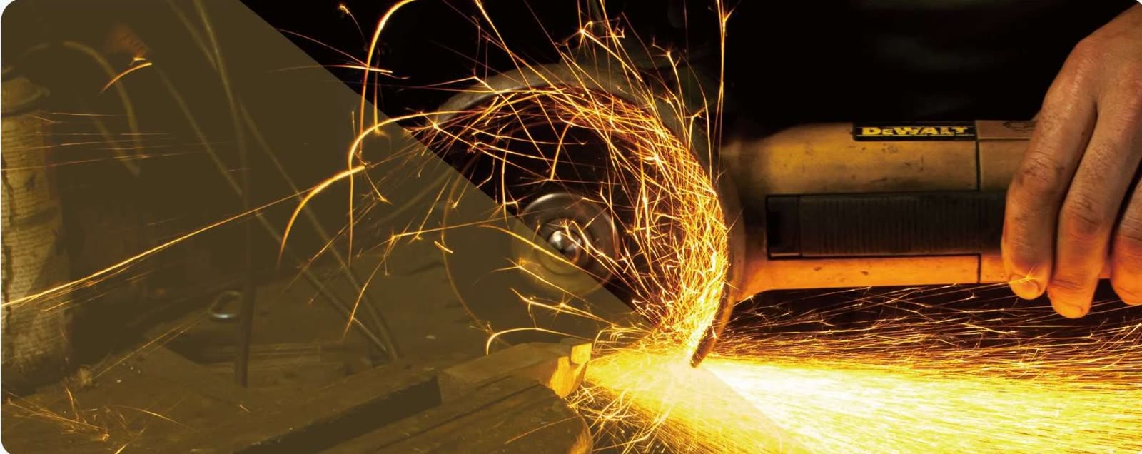 Angle grinder cutting steel with sparks